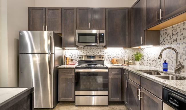 Find your perfect fit at Lakeview Apartments a kitchen with black cabinets