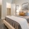 a bedroom with a bed and lamps
