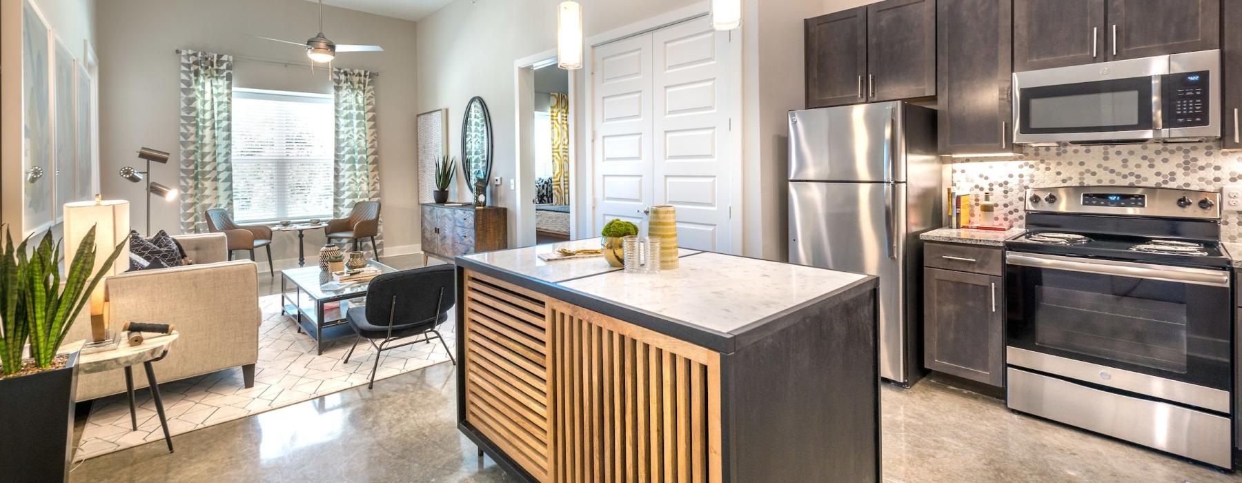 a kitchen with black cabinets