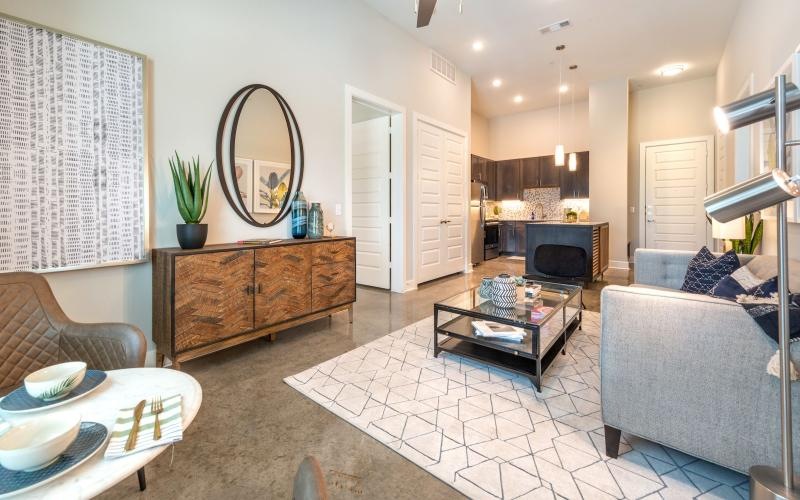 a living room with a tv and couches