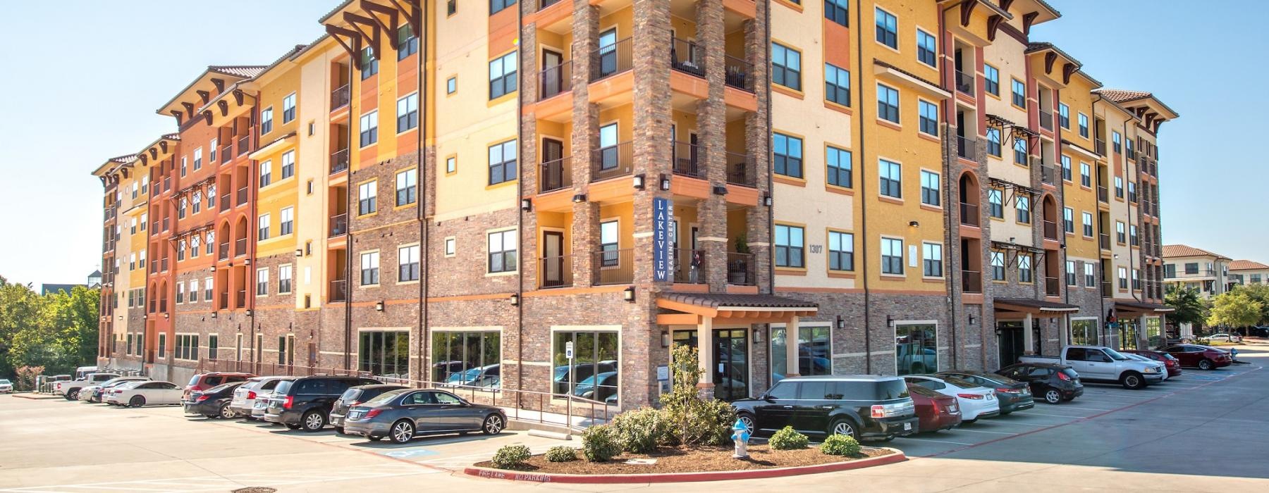 a building with cars parked in front