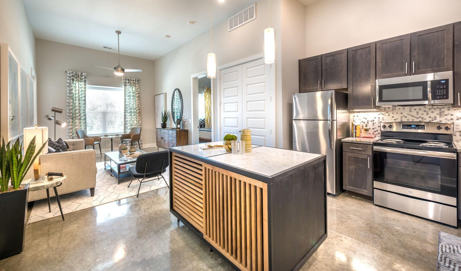 Find your perfect fit at Lakeview Apartments a kitchen with black cabinets